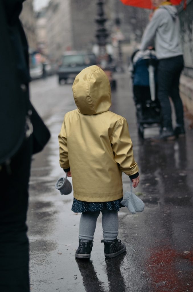 toddler wearing yellow hoodie